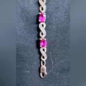 Pink Topaz & Round White
Diamond Ladies Infinity Link tennis bracelet